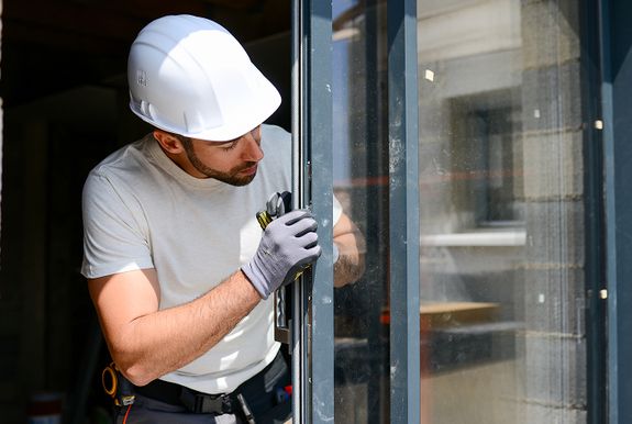 Contractor replacing a window
